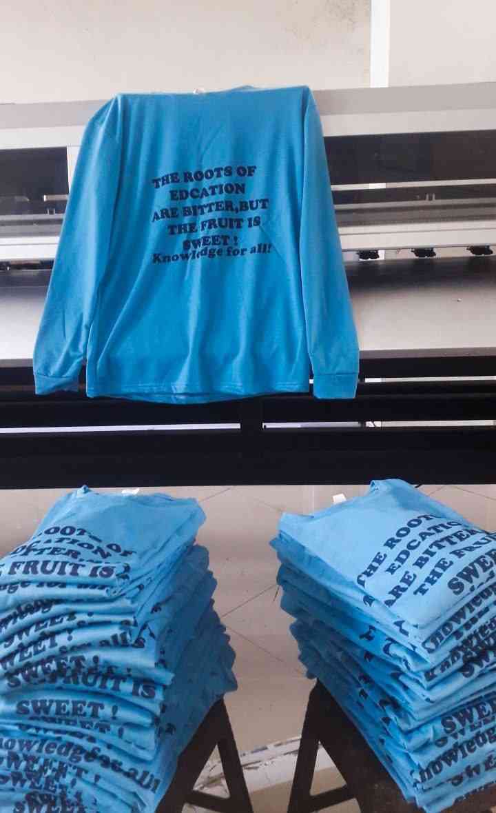 Bulk education campaign shirts on the press